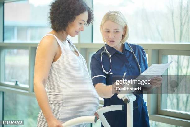 pre natal checks - midwife stock pictures, royalty-free photos & images