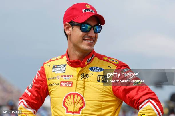 Joey Logano, driver of the Shell Pennzoil Ford, waits on the grid prior to the NASCAR Cup Series FireKeepers Casino 400 at Michigan International...