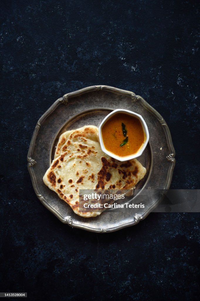Roti prata with fish curry