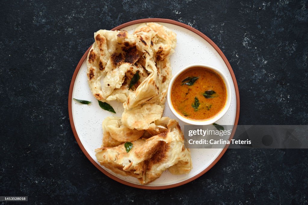 Roti prata with fish curry