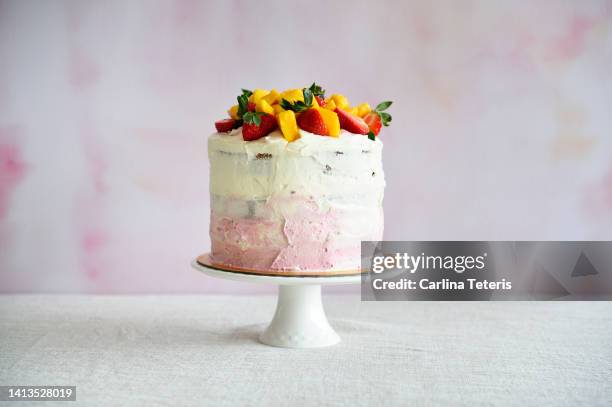 tall pink and white cake - レイヤーケーキ ストックフォトと画像