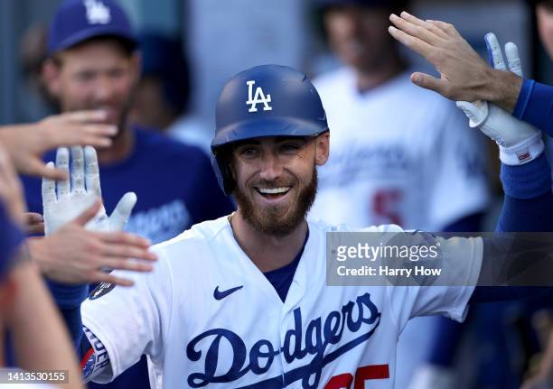 Cody Bellinger of the Los Angeles Dodgers celebrates his second homerun of the game in the dugout, to take a 3-0 lead over the San Diego Padres,...
