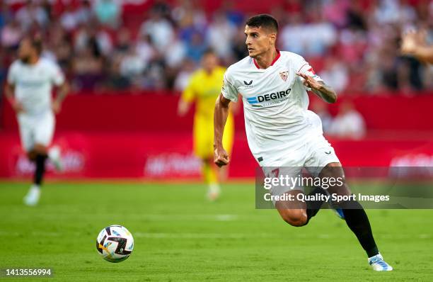 Erik Lamela of Sevilla FC runs with the ball during the XI Trofeo Antonio Puerta match between Sevilla FC and Cadiz CF at Estadio Ramon Sanchez...