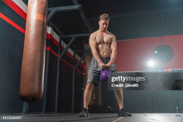 Young And Handsome Male Boxer With Muscular Build Body Doing Dumbbell ...