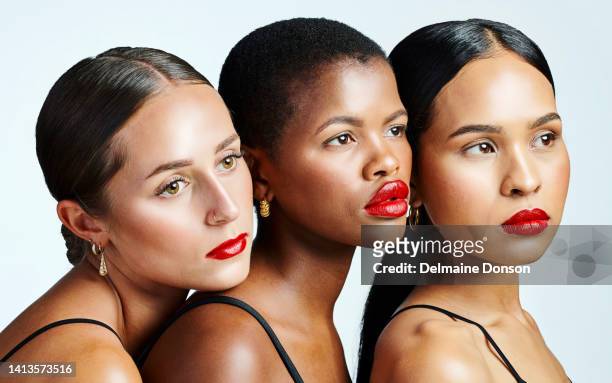 diverse, beautiful and confident women with glowing skin, natural beauty and flawless complexion looking thoughtful against a studio background. group of serious, multiethnic and powerful females - perfect complexion stock pictures, royalty-free photos & images