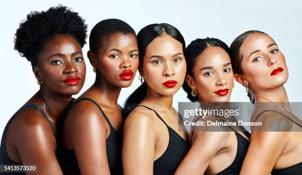 portrait of diverse, beautiful and confident women with glowing skin, natural beauty and flawless complexion posing against a studio background. group of serious, multiethnic and powerful females - perfect complexion stock pictures, royalty-free photos & images