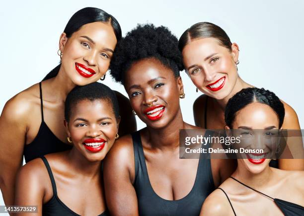 women showing makeup, skincare and beauty while posing  together against white studio background. portrait of a group of international female models looking cheerful, joyful and pretty - females group stock pictures, royalty-free photos & images
