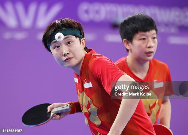 Tianwei Feng and Jian Zeng of Team Singapore compete during the Table Tennis Women's Doubles Gold Medal match against Minhyung Jee and Jian Fang Lay...