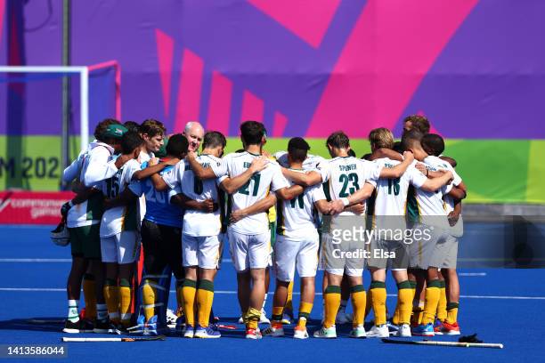 Athletes of Team South Africa huddle up following defeat in the Men's Hockey Final for the bronze medal on day eleven of the Birmingham 2022...