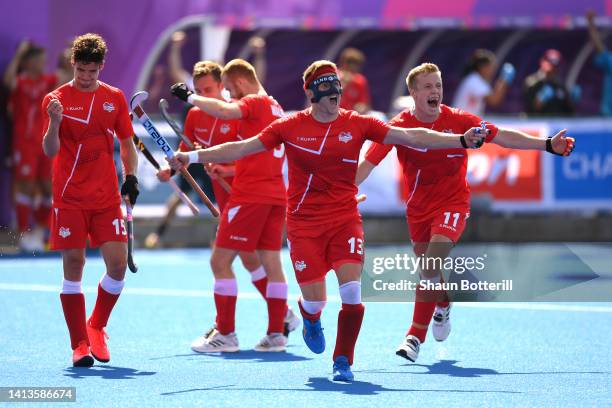 Samuel Ward of Team England celebrates their side's sixth goal scored by teammate Zachary Wallace from the penalty spot during the Men's Hockey Final...