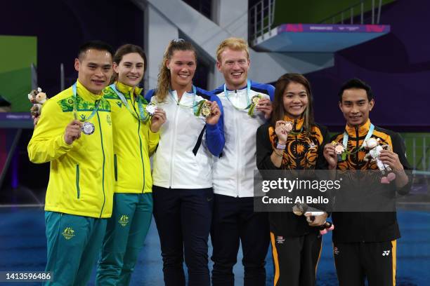 Silver medalists, Shixin Li and Maddison Keeney of Team Australia, Gold medalists, James Philip Heatly and Grace Elizabeth Reid of Team Scotland and...