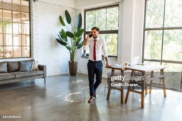 businessman in full suit standing and talking on the smart phone - finance and economy stock pictures, royalty-free photos & images