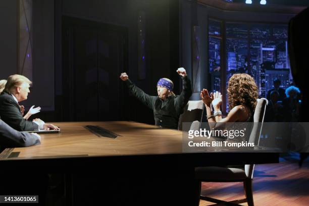 Donald Trump interacts with Bret Michaels and Holly Robinson Peete during the Celebrity Apprentice livre season finale on May 16, 2010 in New York...