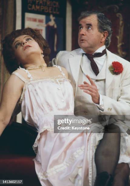 British actress Prunella Scales wearing Edwardian underwear, and British actor Rodney Bewes , wearing a white suit with a red button hole, in a scene...