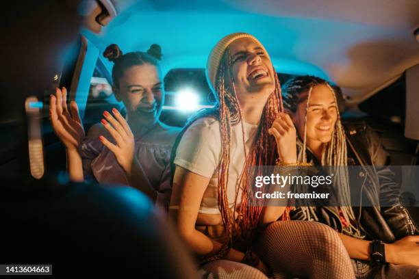 girlfriends having fun - back seat stock pictures, royalty-free photos & images