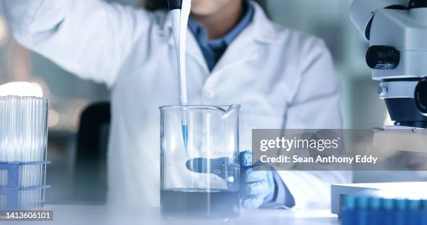 scientist, doctor or technician doing a drug trial, test or experiment while working in a lab, science facility or hospital. one medical researcher, expert or professsional making a discovery at work - trial stock pictures, royalty-free photos & images