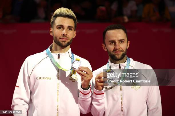 Silver medalists Sean Vendy and Ben Lane of Team England pose for a photo during the medal ceremony for the Badminton Men's Doubles on day eleven of...