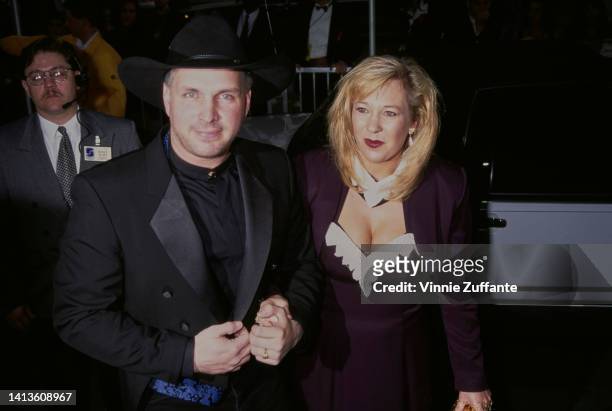 Garth Brooks and his wife, American songwriter Sandy Mahl attend the 23rd Annual American Music Awards, held at the Shrine Auditorium in Los Angeles,...