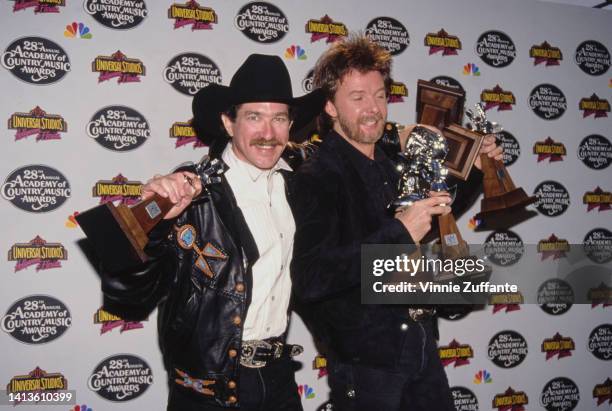 Kix Brooks and Ronnie Dunn smile as the hold multiple awards at the 28th Annual Academy of Country Music Awards, held at California Universal...