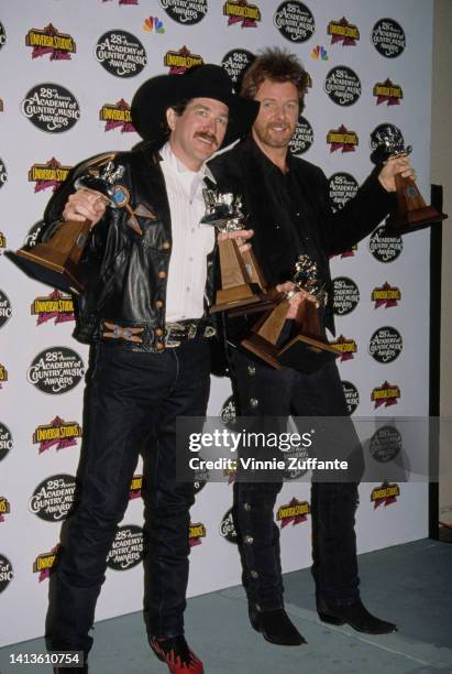 Kix Brooks and Ronnie Dunn smile as they hold multiple awards at the 28th Annual Academy of Country Music Awards, held at California Universal...