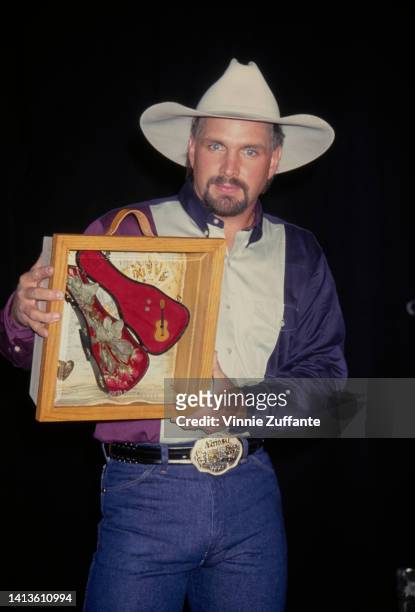 Garth Brooks holds up award at the 1st Annual VH1 Honors Artists and Their Causes at Shrine Auditorium in Los Angeles, California, United States,...