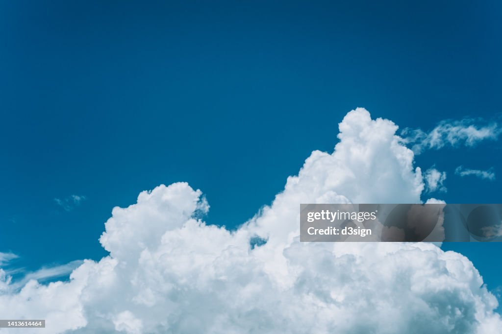 White clouds in blue sky on a sunny Summer day