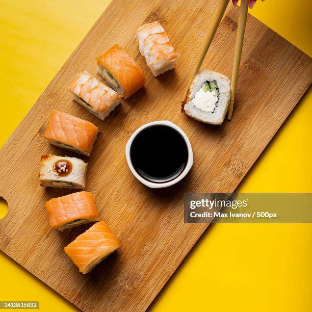 high angle view of sushi served on table - soy sauce stock pictures, royalty-free photos & images