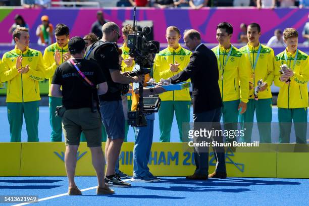 Prince Edward, Earl of Wessex presents medals to Gold medalists Team Australia during the Men's Hockey - Medal ceremony on day eleven of the...