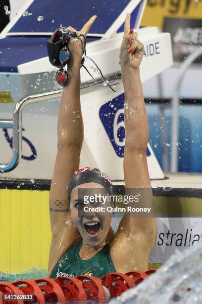 Stephanie Rice of Australia celebrates winning the Final of the Women's 400 Metre Individual Medley during day one of the Australian Olympic Swimming...