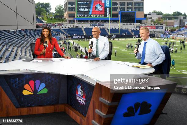 Sports host Maria Taylor with analysts Tony Dungy and Jason Garrett take part in a segment prior to the 2022 Pro Football Hall of Fame Game between...