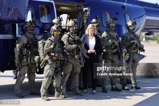 German Interior Minister Nancy Faeser talks with members of the GSG 9 federal police special forces unit during a visit to their training center on...