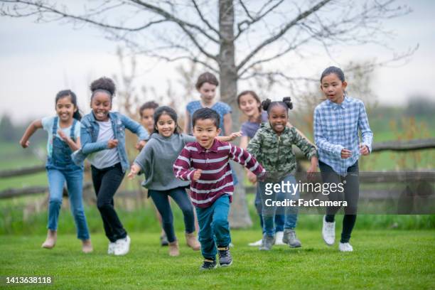 children running outside - student wellbeing stock pictures, royalty-free photos & images