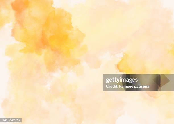 hand drawn watercolor yellow paint on canvas - waterverfachtergrond stockfoto's en -beelden
