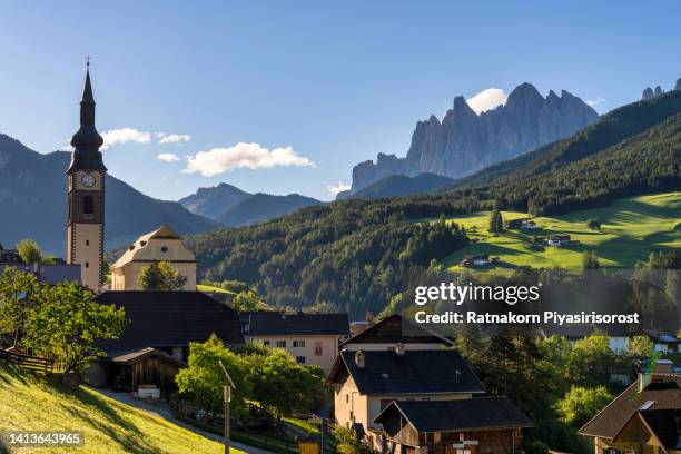 sunrise scene of landscape of italian alp the dolomites with chiesa parrocchiale di san pietro in funes valley, south tyrol, italy - bolzano stock pictures, royalty-free photos & images