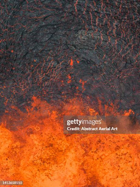 drone image looking down on the edge of an active volcano, iceland - vulkanisch gesteente stockfoto's en -beelden