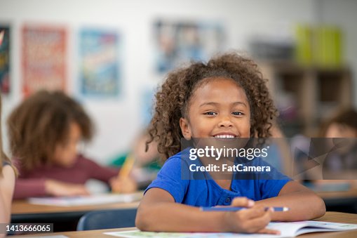 Elementary Student Writing in Class Elementary Student Writing in Class