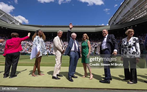 Rod Laver of Australia waves to the crowd, he is flanked by Bjorn Borg, Venus Williams, Billie Jean King, Chris Evert, John Newcombe and Margaret...