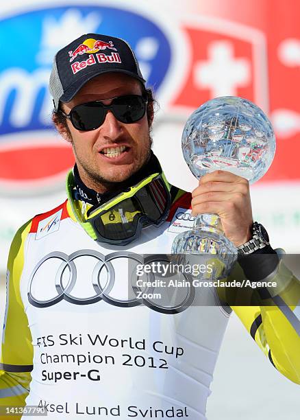 Aksel Lund Svindal of Norway wins the Overall World Cup SuperG globe during the Audi FIS Alpine Ski World Cup Men's SuperG on March 15, 2012 in...