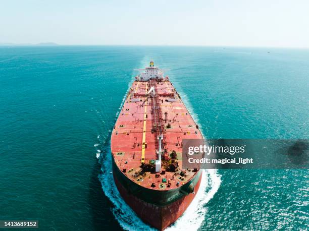 aerial view top speed with beautiful wave of container ship full load container. - tanker stockfoto's en -beelden