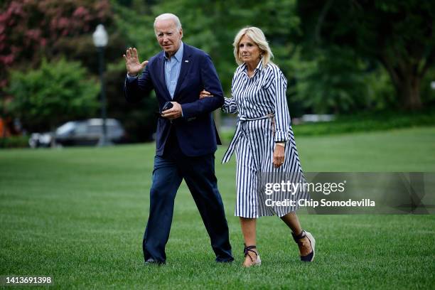 President Joe Biden and first lady Jill Biden walk across the South Lawn as they return to the White House on August 08, 2022 in Washington, DC. The...