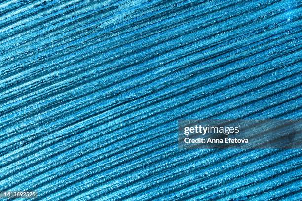 texture of blue glittering eye shadows. concept of trendy cosmetic products. macrophotography - lipgloss bildbanksfoton och bilder