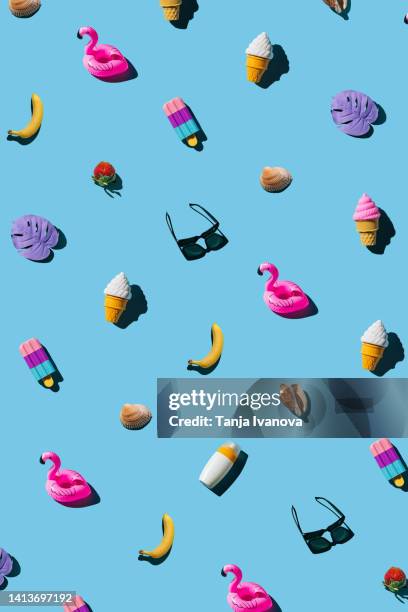 pattern of various summer objects on a blue background. minimal summer holidays concept. - sunglasses overhead stock pictures, royalty-free photos & images