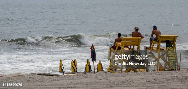 Lifeguards keeping a close eye on bathers and surfers because of the high risk rip currents in the Atlantic Ocean-facing Lido Beach in Lido Beach,...