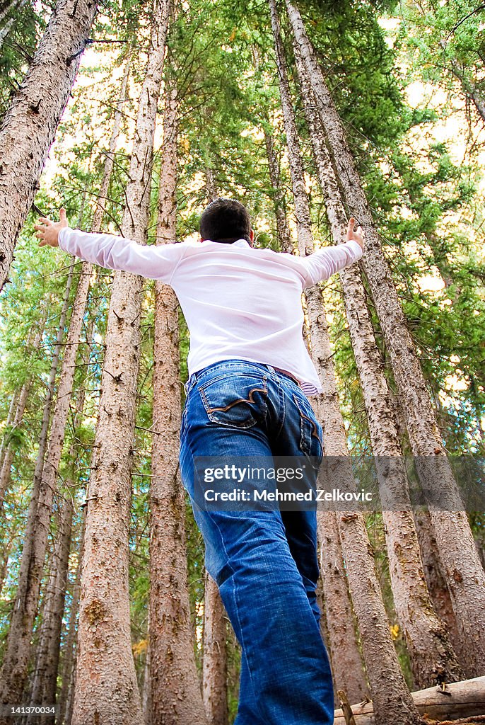 Young man with hands outstretched