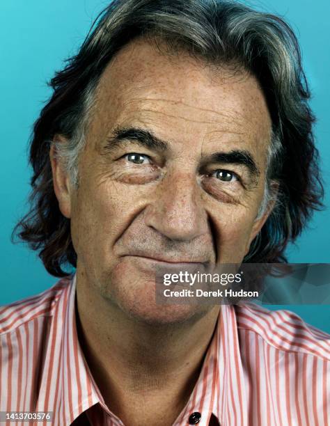 Portrait of English fashion designer Sir Paul Smith, in a pink and white striped, pop button-style shirt , as he poses in his Covent Garden office,...