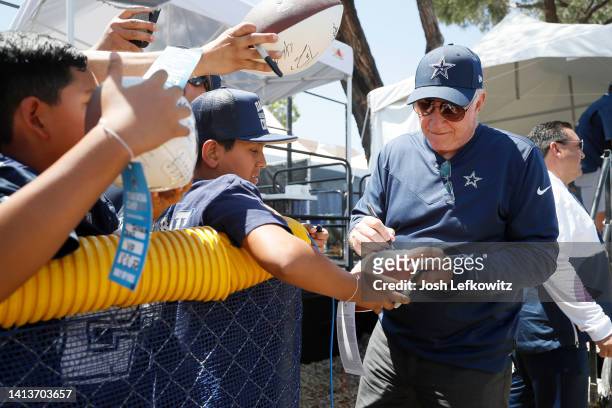 Owner and President Jerry Jones of the Dallas Cowboys signs autographs after training camp at River Ridge Fields on August 08, 2022 in Oxnard,...