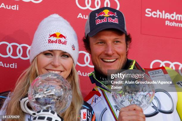 Lindsey Vonn of the USA and Aksel Lund Svindal of Norway win the Overall World Cup SuperG globes during the Audi FIS Alpine Ski World Cup Men's...