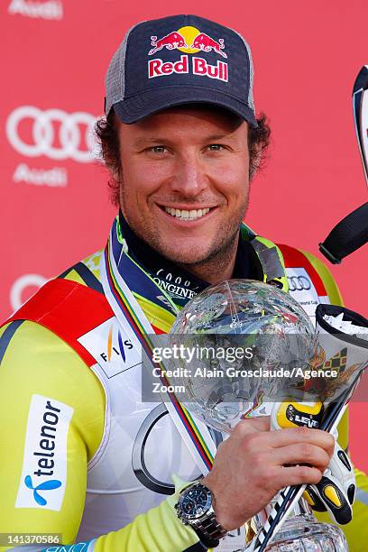Aksel Lund Svindal of Norway wins the Overall World Cup SuperG globe during the Audi FIS Alpine Ski World Cup Men's SuperG on March 15, 2012 in...