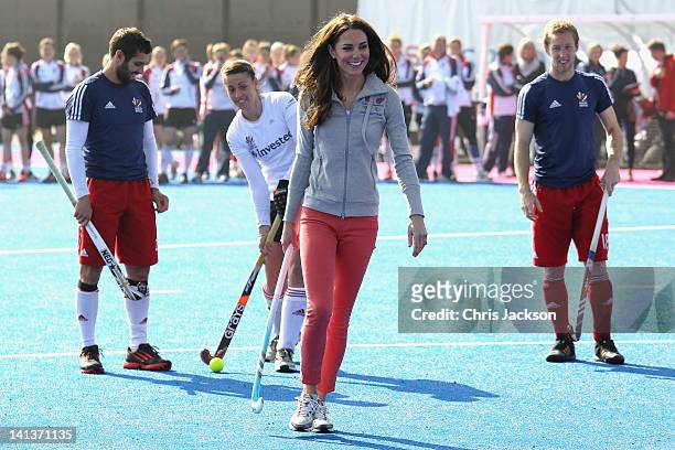 Catherine, Duchess of Cambridge plays hockey with the GB hockey teams at the Riverside Arena in the Olympic Park on March 15, 2012 in London,...
