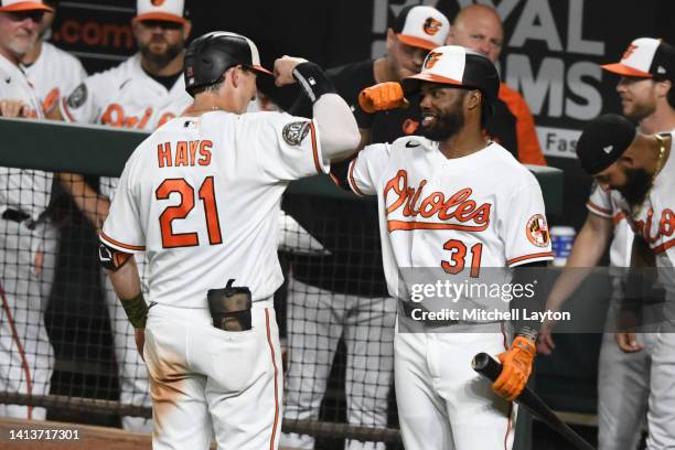 Austin Hays of the Baltimore Orioles celebrates a solo home run in the sixth inning with Cedric Mullins during a baseball game against the Toronto...